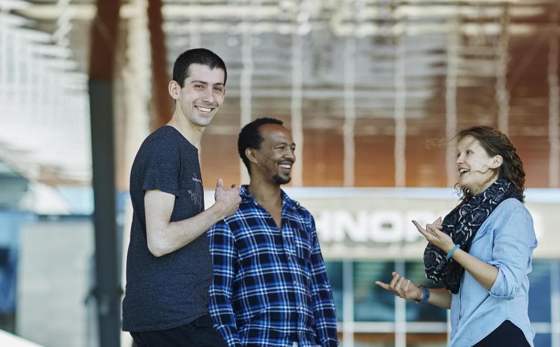 Three students talking