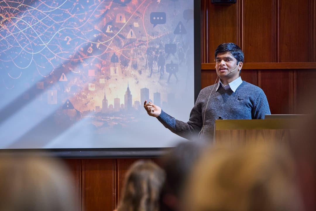Sushant Gautam presenting on stage