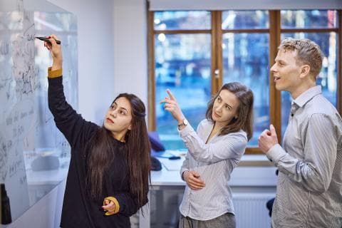 DataSed department whiteboards and one person points to the board.